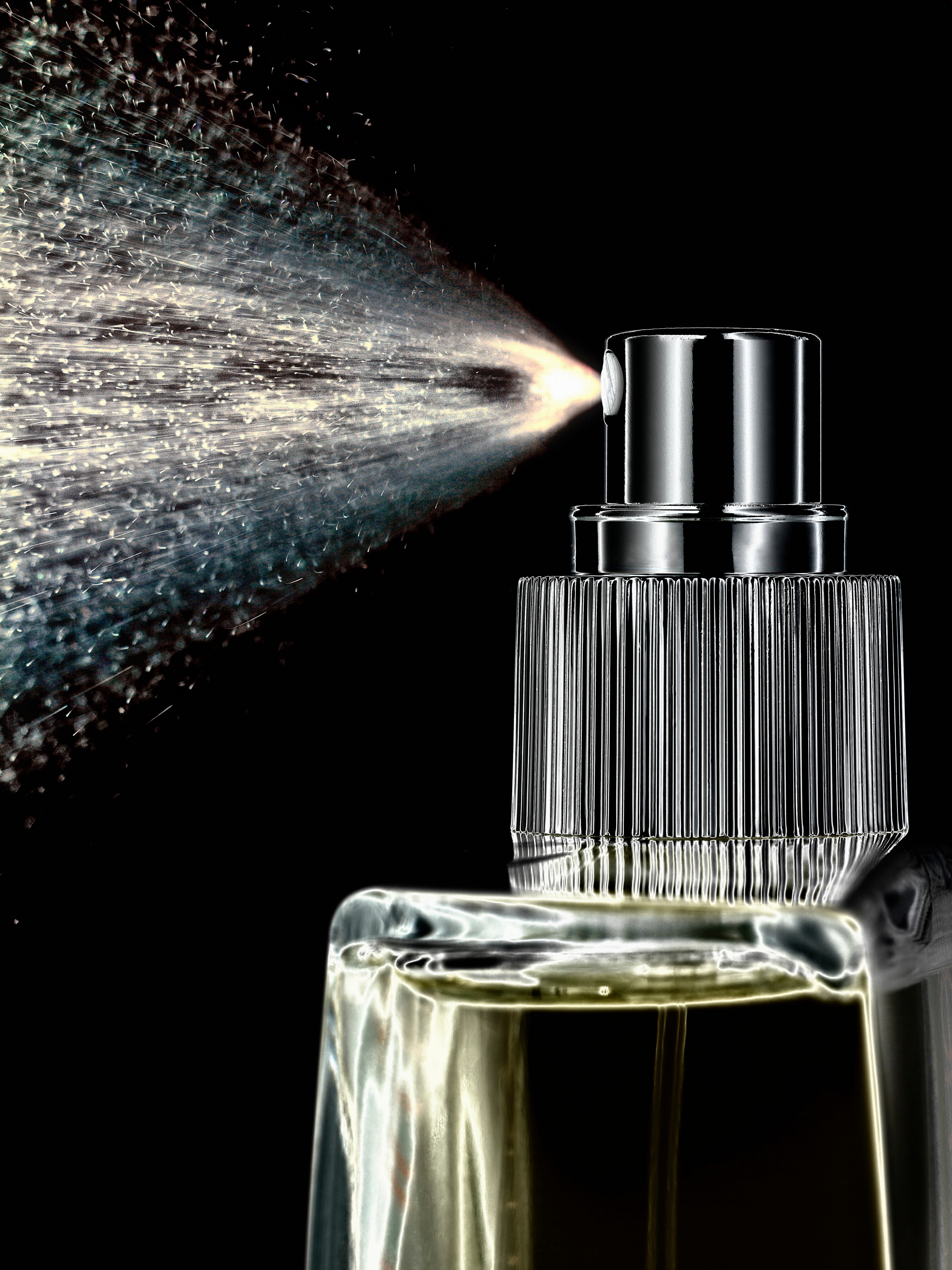 close-up-of-perfume-spraying-from-bottle-2024-10-18-10-01-12-utc.jpg